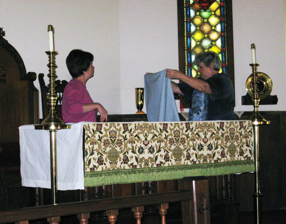 Pam and Leslie Prepare Altar for Service